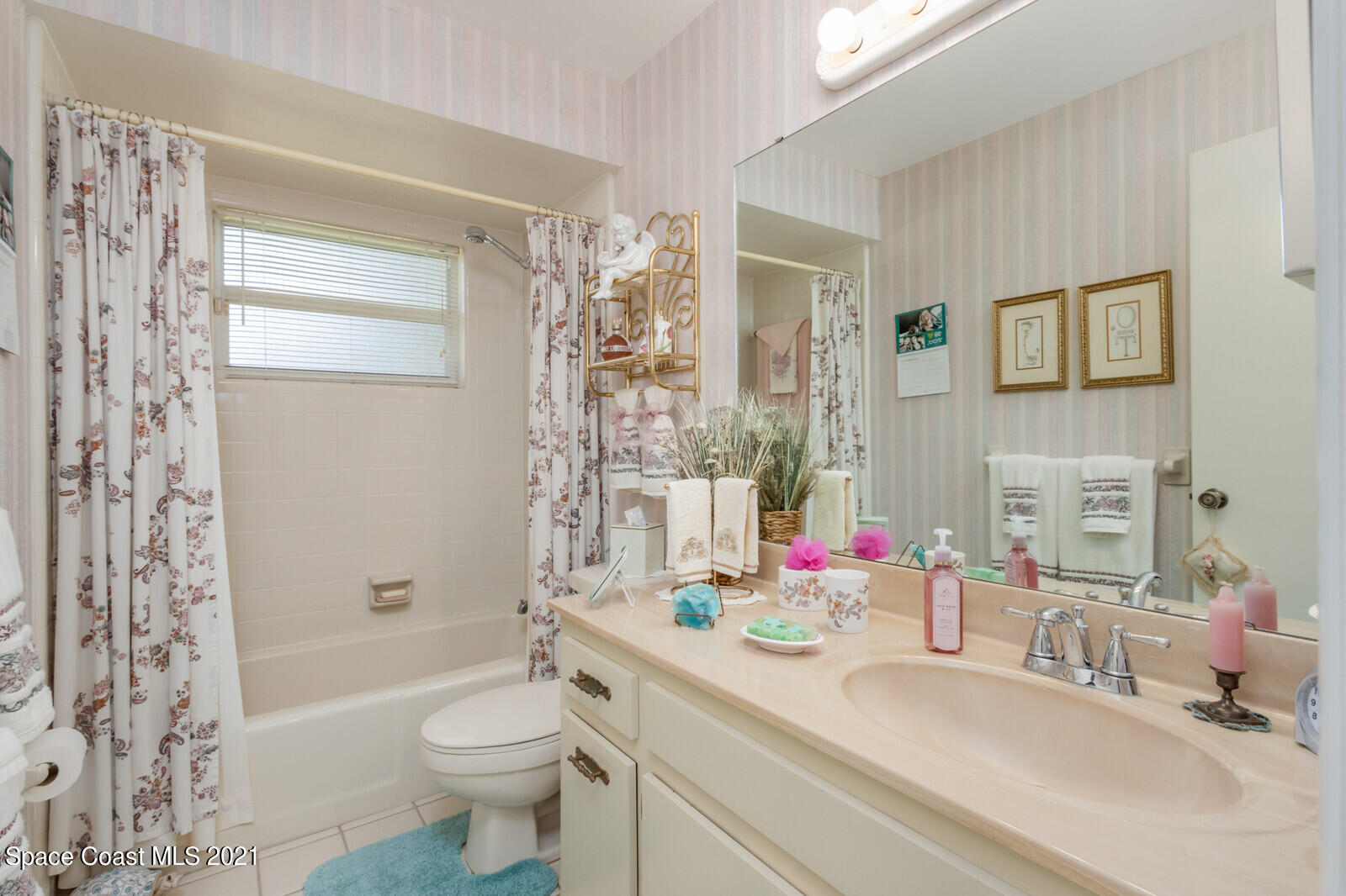 1953 Trimble Road Melbourne, FL 32934 - Photo 23 of 70 a bathroom with a sink a toilet and shower