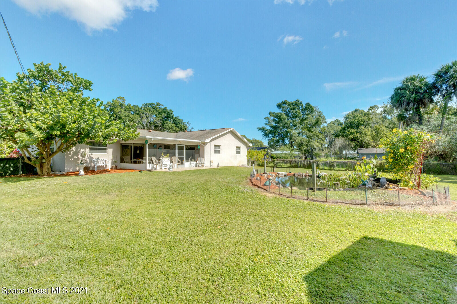 1953 Trimble Road Melbourne, FL 32934 - Photo 4 of 70 a front view of a house with a yard