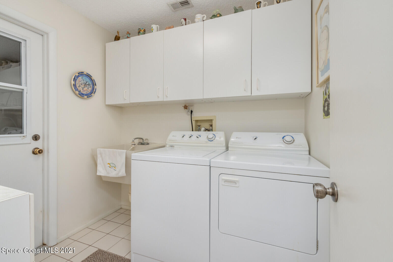 1953 Trimble Road Melbourne, FL 32934 - Photo 31 of 70 a utility room with dryer and washer