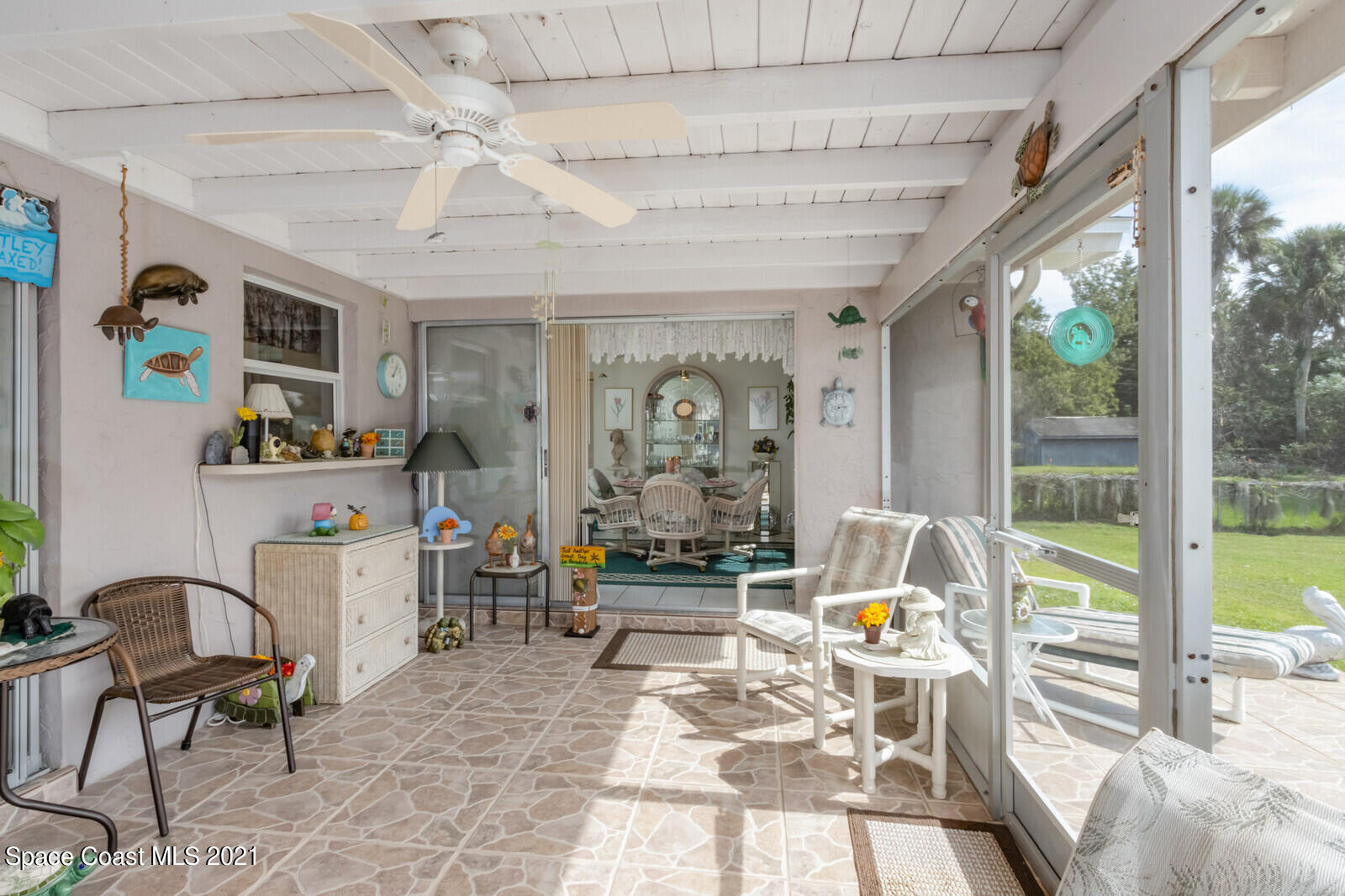 1953 Trimble Road Melbourne, FL 32934 - Photo 32 of 70 a living room with furniture and a large window
