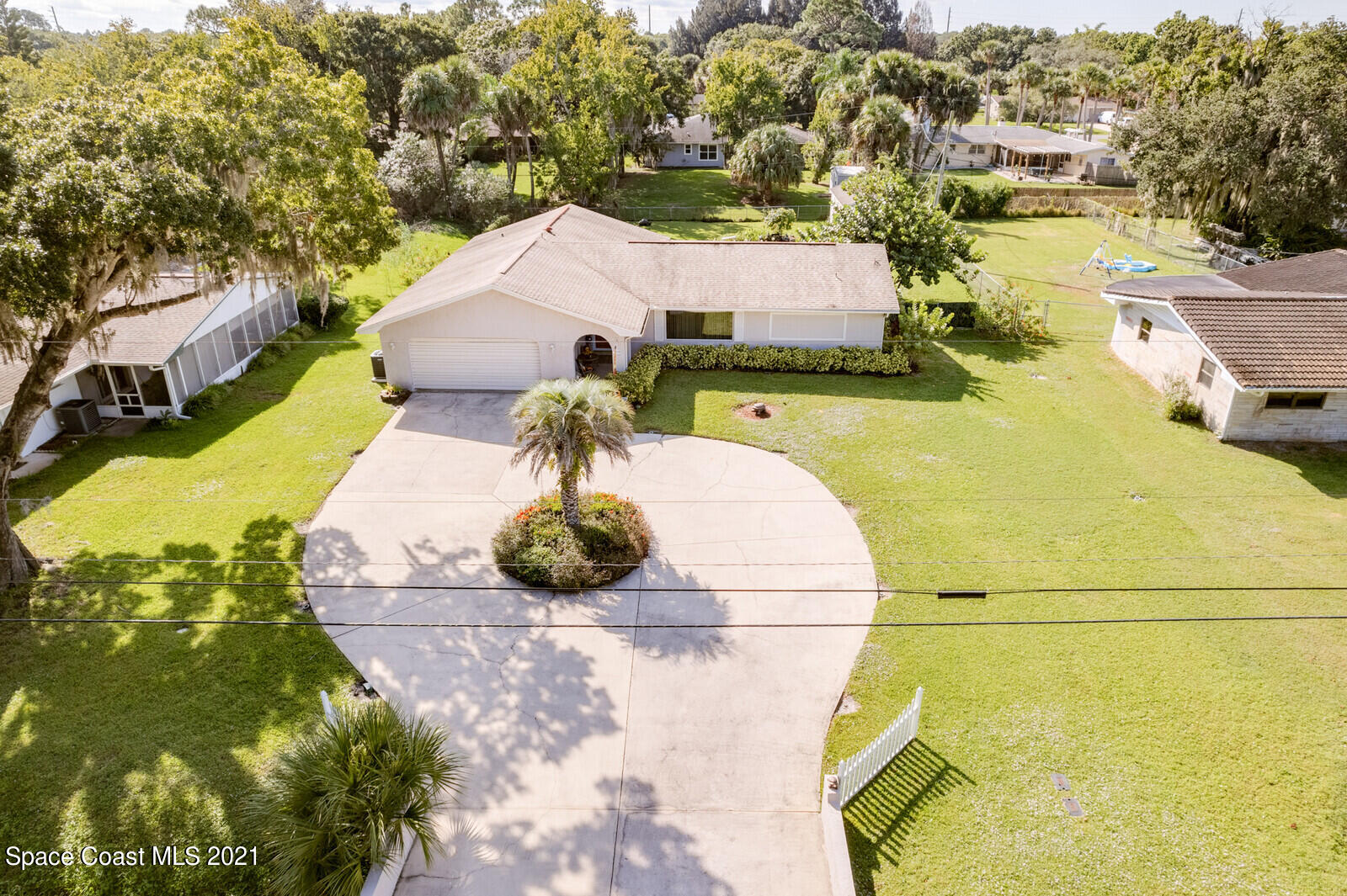 1953 Trimble Road Melbourne, FL 32934 - Photo 36 of 70 an aerial view of a house with a yard