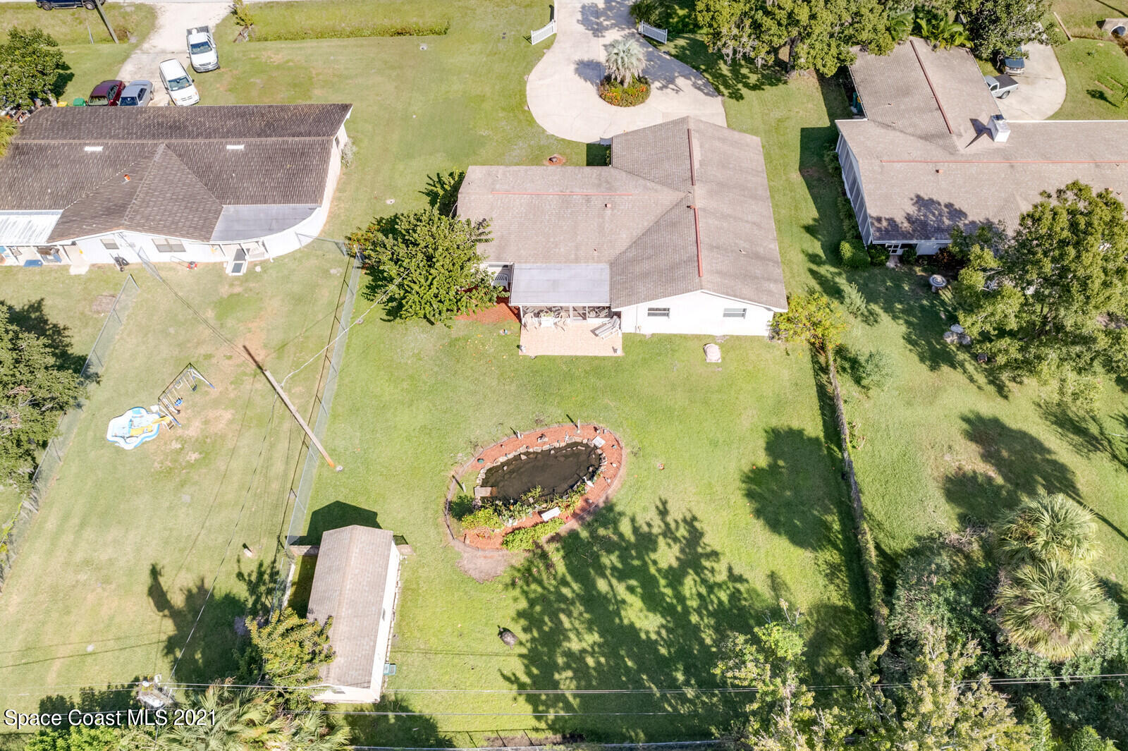 1953 Trimble Road Melbourne, FL 32934 - Photo 38 of 70 an aerial view of residential house with swimming pool