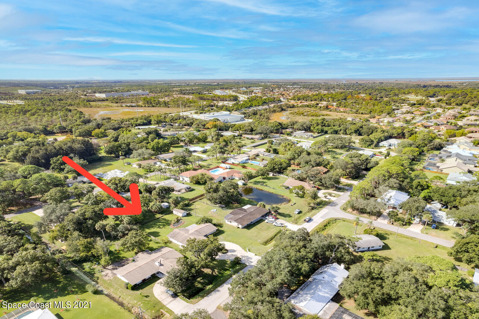 1953 Trimble Road Melbourne, FL 32934 - Photo 40 of 70 an aerial view of residential building and lake