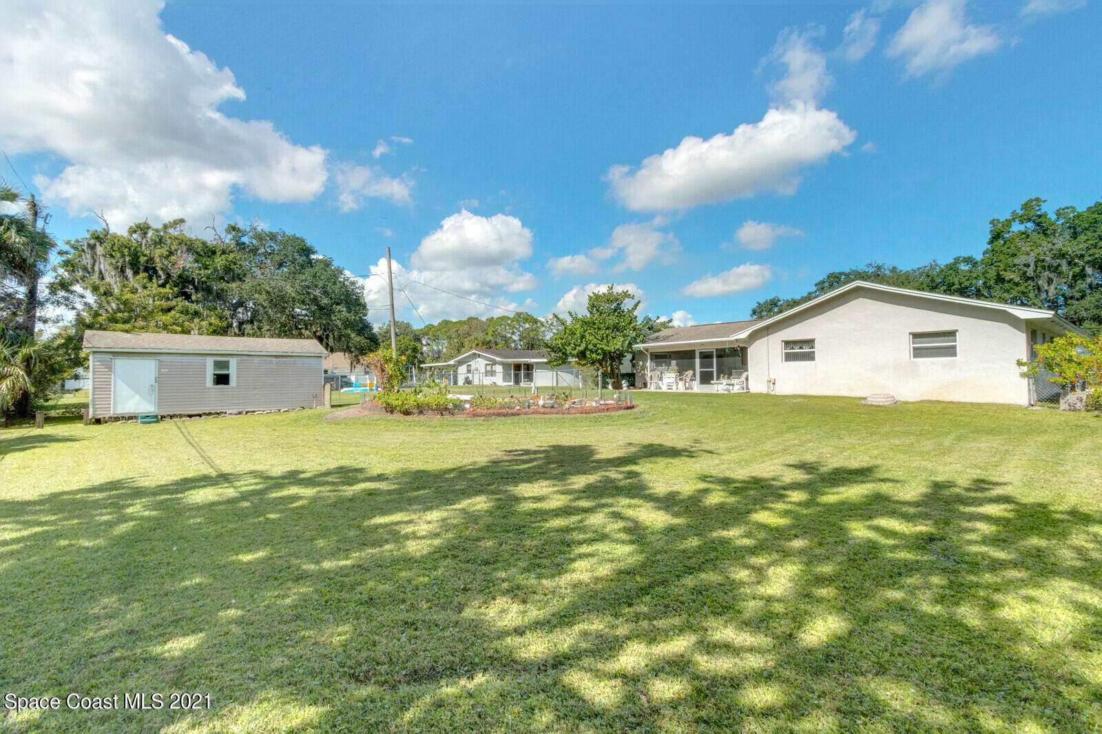 1953 Trimble Road Melbourne, FL 32934 - Photo 5 of 70 a view of a house with a backyard