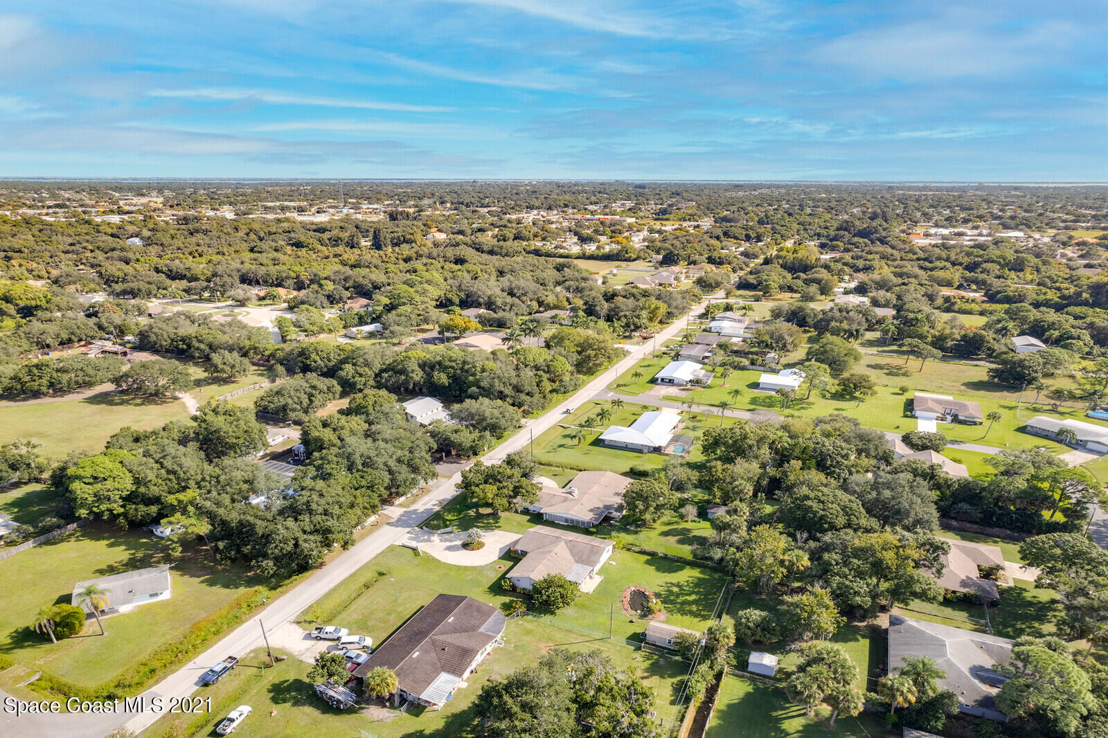 1953 Trimble Road Melbourne, FL 32934 - Photo 41 of 70 an aerial view of residential building and parking space