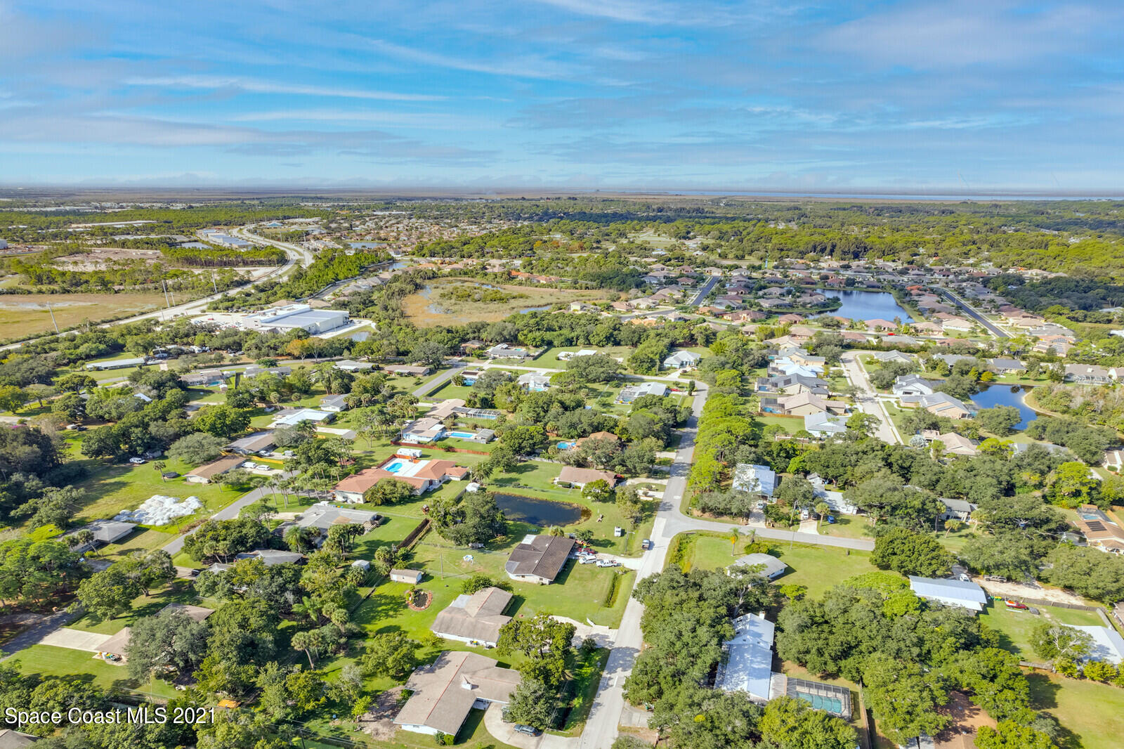 1953 Trimble Road Melbourne, FL 32934 - Photo 43 of 70 an aerial view of residential building and an ocean