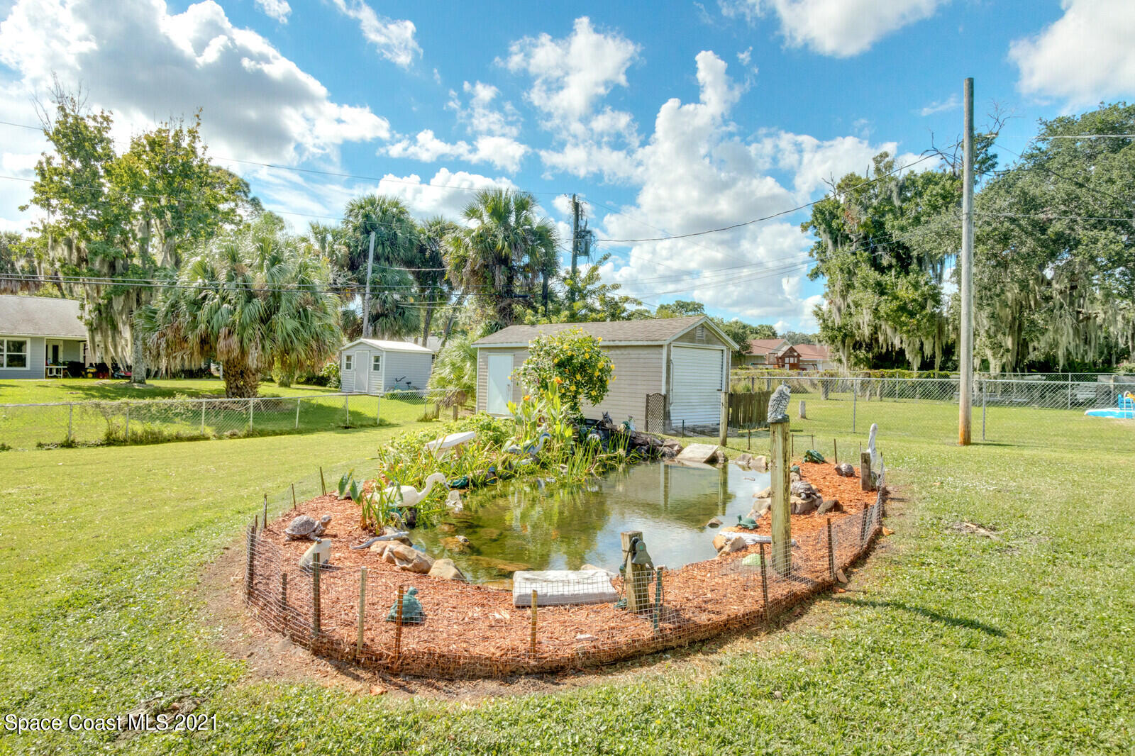 1953 Trimble Road Melbourne, FL 32934 - Photo 7 of 70 a view of a park with large trees