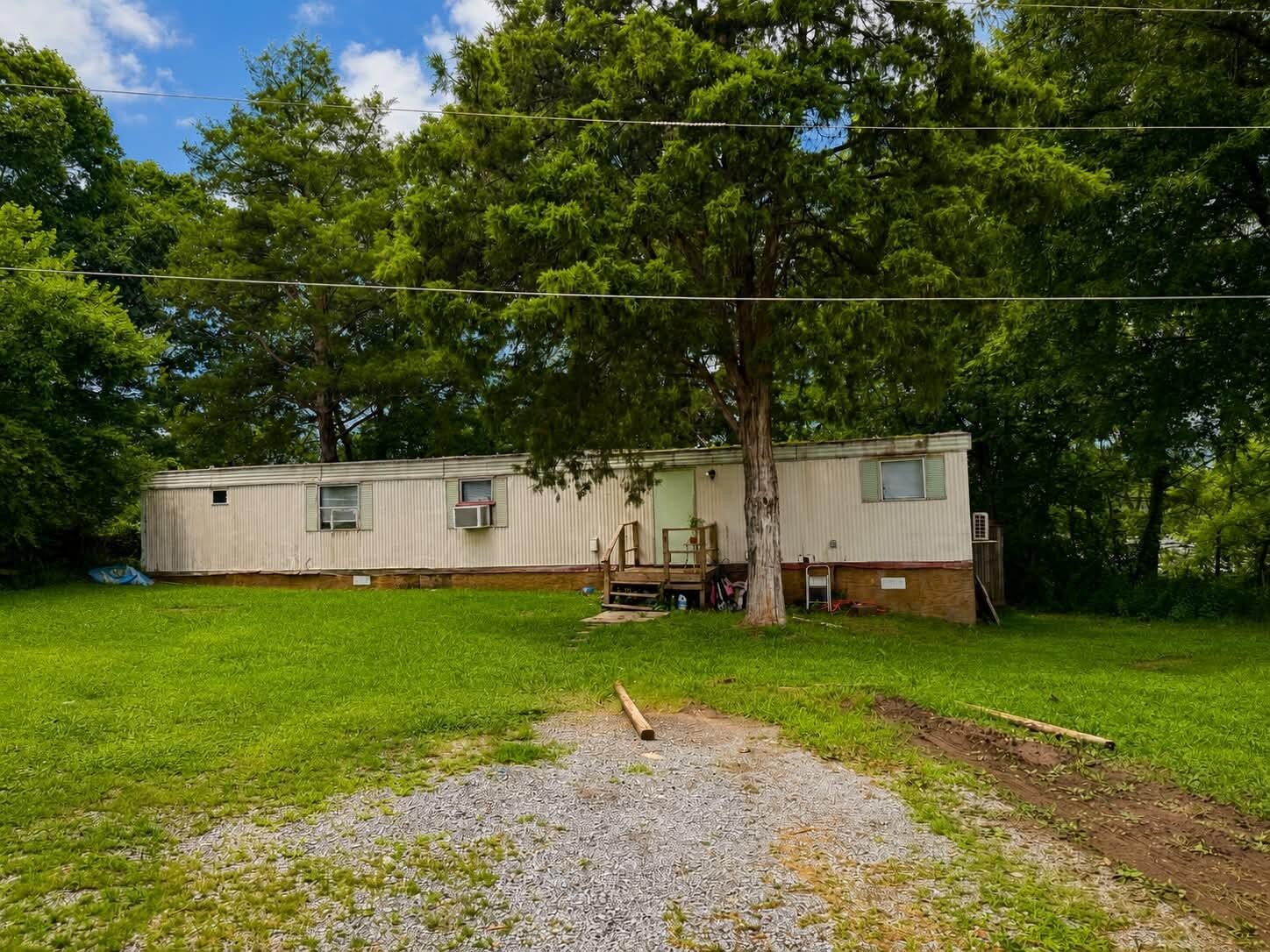 55515611 River Road Decatur, TN 37322 - Photo 8 of 15 a view of a backyard with a garden and entertaining space