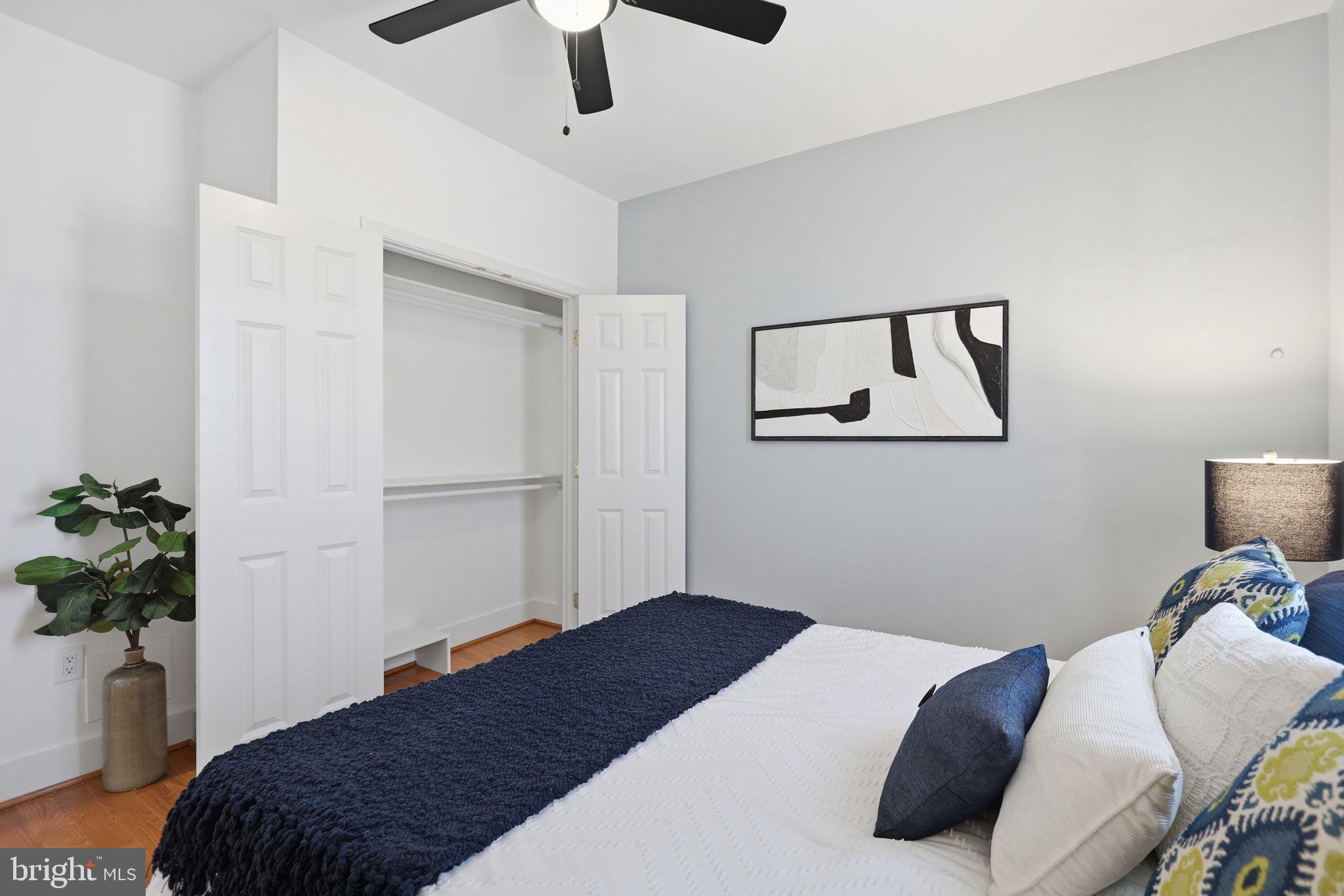 1020 10th Street Northeast Washington, DC 20002 - Photo 29 of 36 a bedroom with a bed and a potted plant