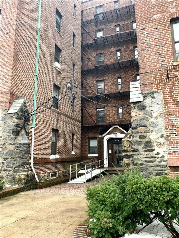 a view of a building with sitting area