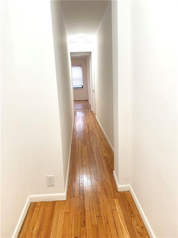 402 Bay Ridge Parkway, Unit 5 Brooklyn, NY 11209 - Photo 11 of 14 a view of a hallway with wooden floor