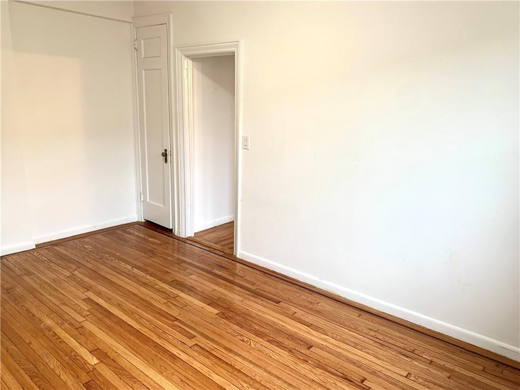 402 Bay Ridge Parkway, Unit 5 Brooklyn, NY 11209 - Photo 12 of 14 a view of empty room with wooden floor