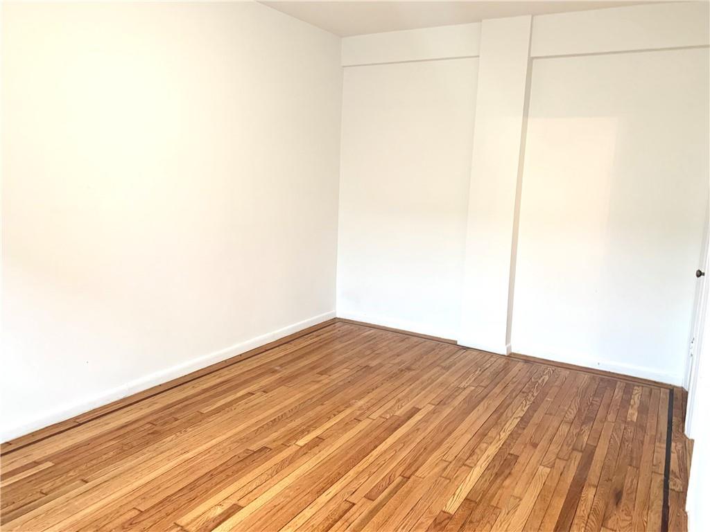 402 Bay Ridge Parkway, Unit 5 Brooklyn, NY 11209 - Photo 13 of 14 a view of empty room with wooden floor