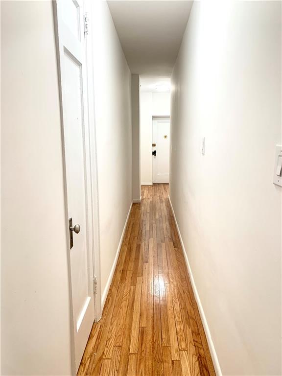 402 Bay Ridge Parkway, Unit 5 Brooklyn, NY 11209 - Photo 6 of 14 a view of a hallway with wooden floor