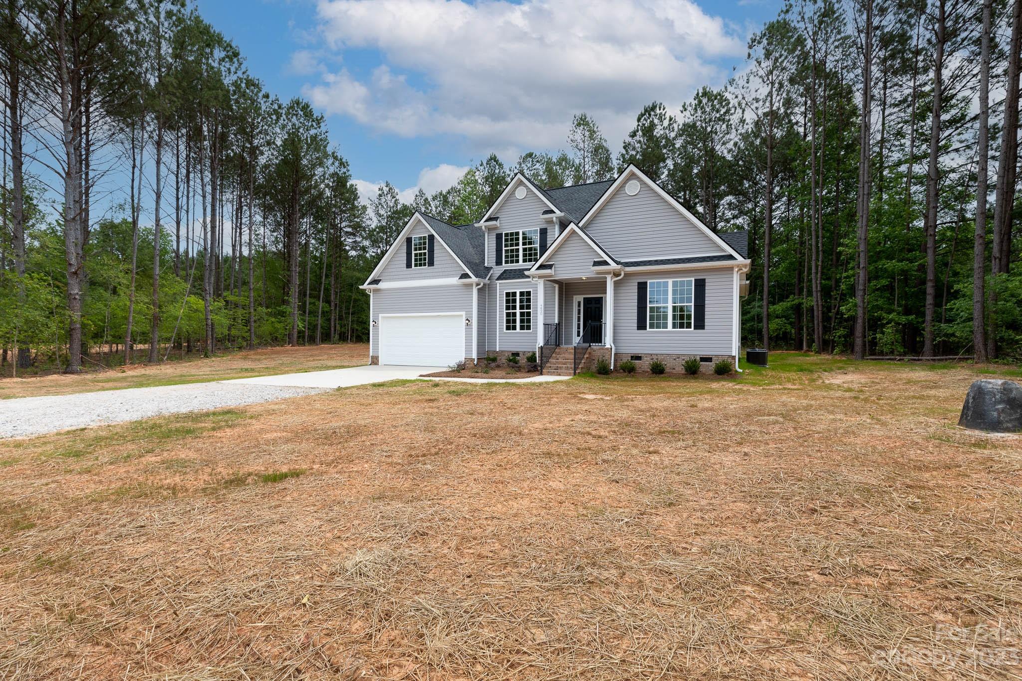 4420 Culp Road Edgemoor, SC 29712 - Photo 2 of 25 a front view of a house with a yard and trees