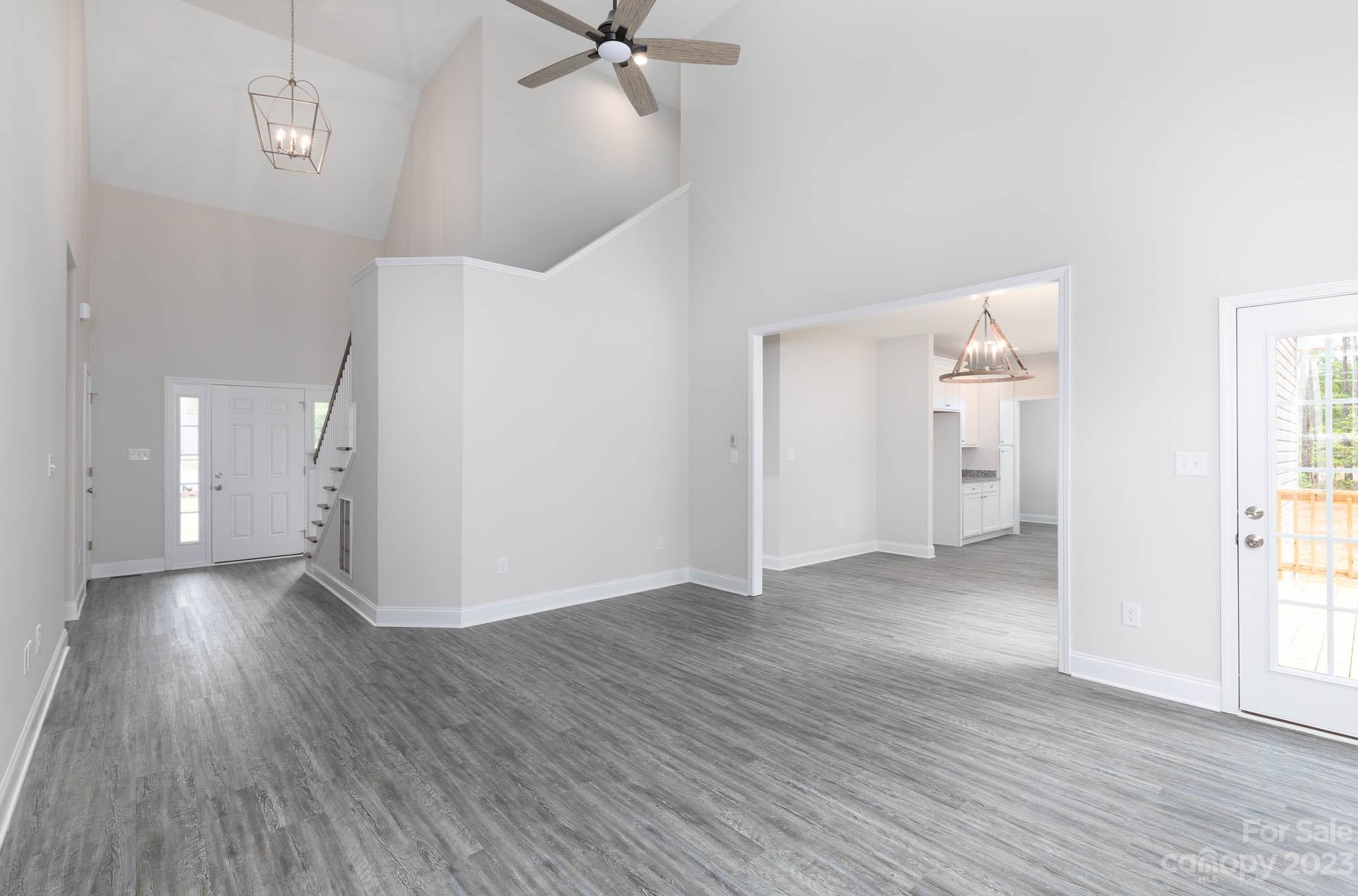 4420 Culp Road Edgemoor, SC 29712 - Photo 8 of 25 an empty room with wooden floor and windows