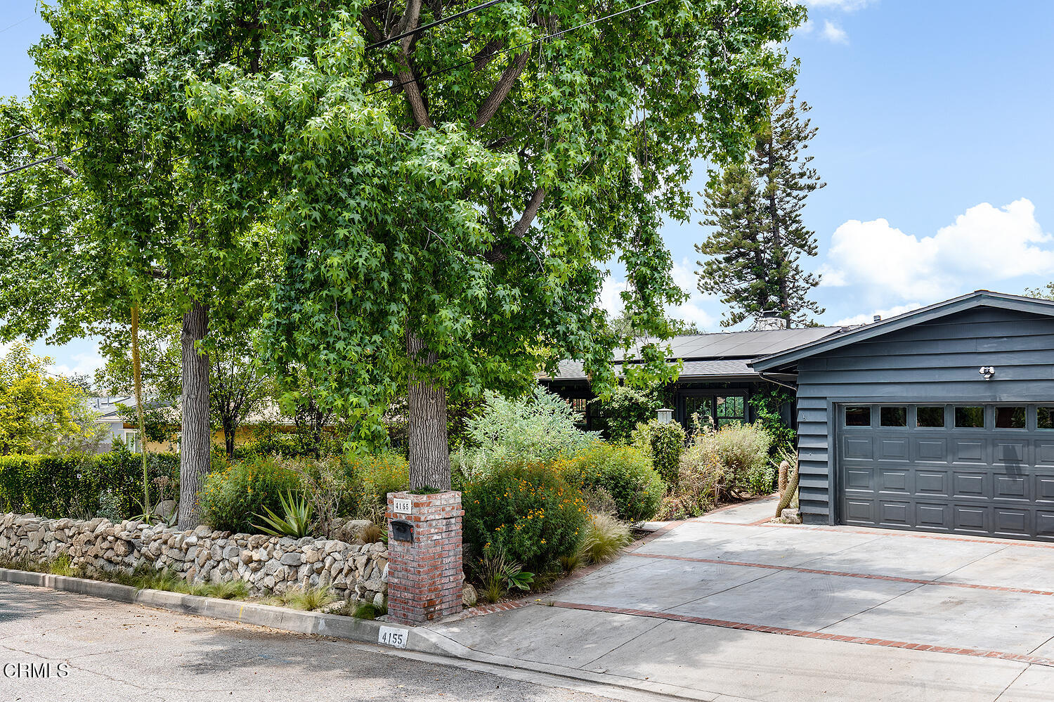 4155 Aralia Road Altadena, CA 91001 - Photo 2 of 40 a front view of a house with a garden