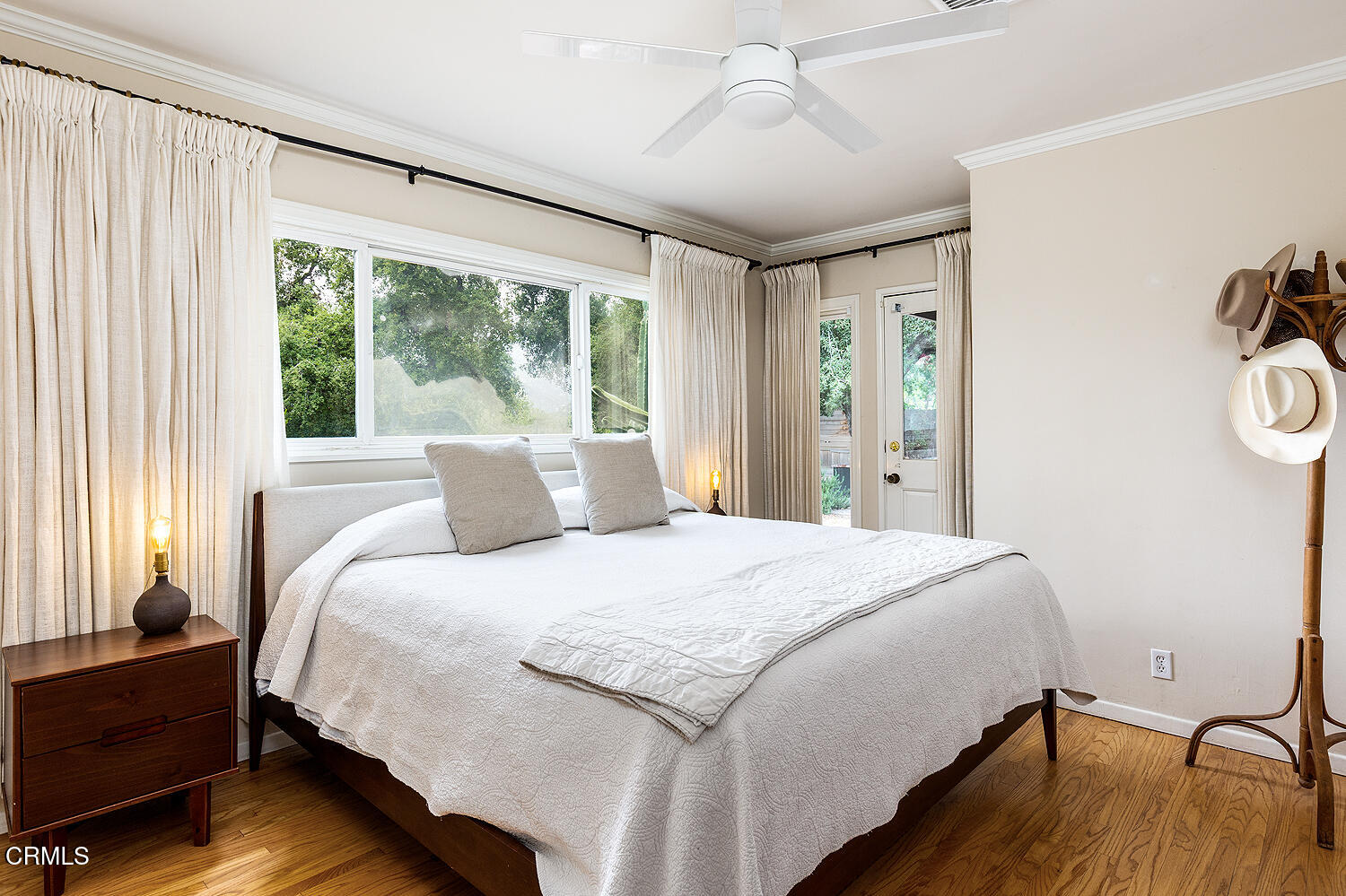 4155 Aralia Road Altadena, CA 91001 - Photo 22 of 40 a bedroom with a bed and wooden floor