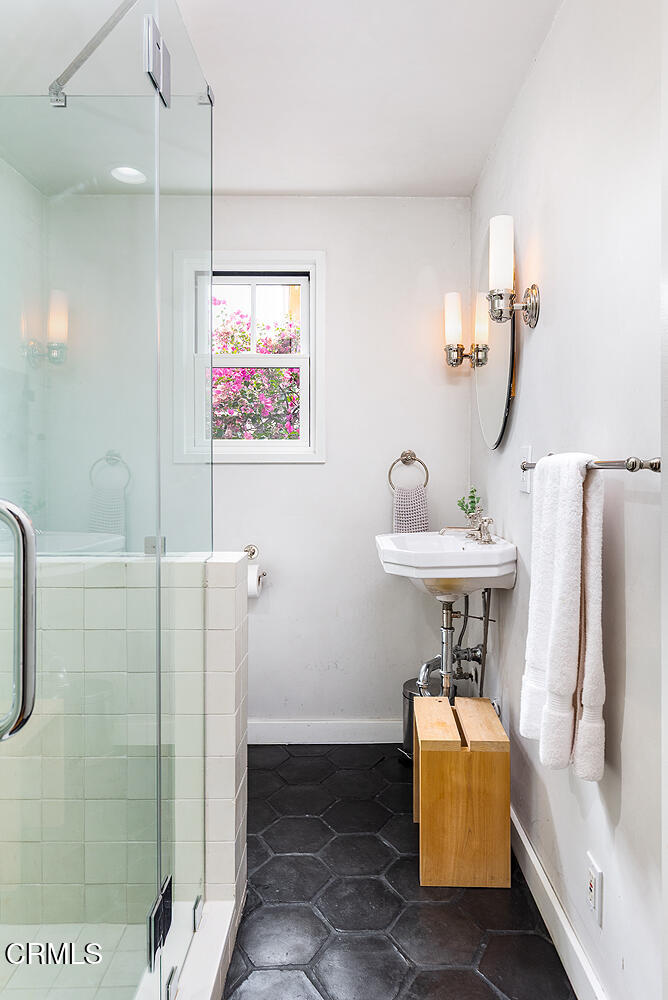 4155 Aralia Road Altadena, CA 91001 - Photo 28 of 40 a bathroom with a sink and a shower