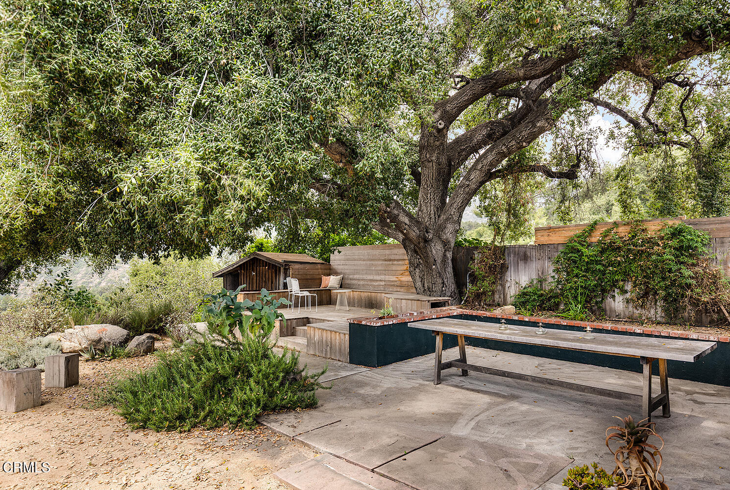 4155 Aralia Road Altadena, CA 91001 - Photo 29 of 40 a roof deck with table and chairs and potted plants