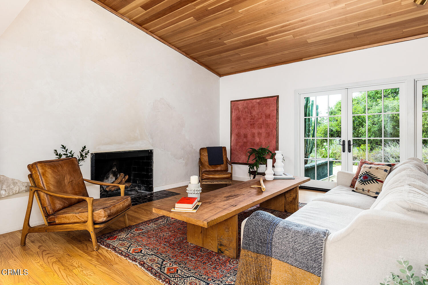 4155 Aralia Road Altadena, CA 91001 - Photo 10 of 40 a living room with furniture a fireplace and a large window