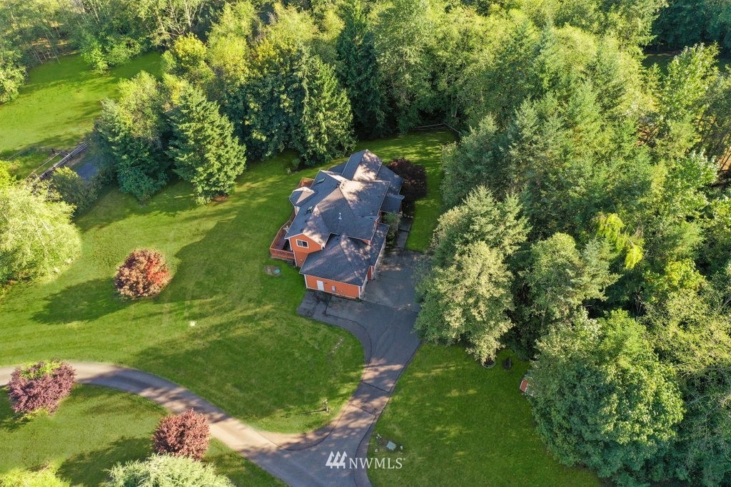 10606 Wagner Road Snohomish, WA 98290 - Photo 2 of 40 a backyard of a house with a yard and outdoor seating