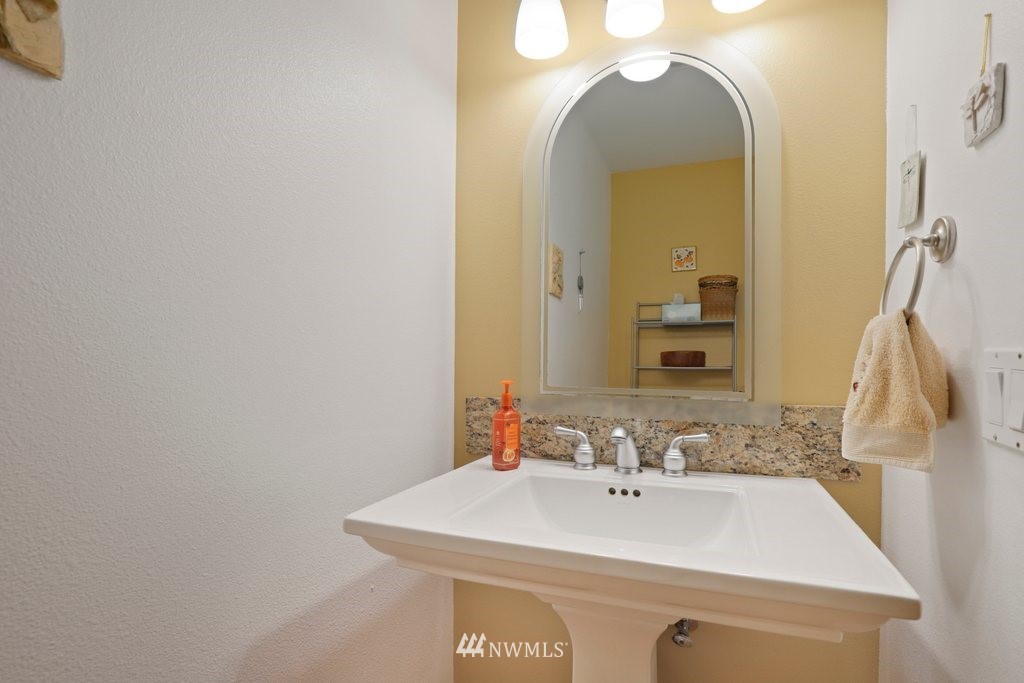 10606 Wagner Road Snohomish, WA 98290 - Photo 16 of 40 a bathroom with a sink and a mirror