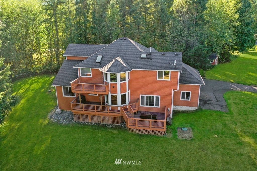 10606 Wagner Road Snohomish, WA 98290 - Photo 31 of 40 a aerial view of a house with a yard table and chairs