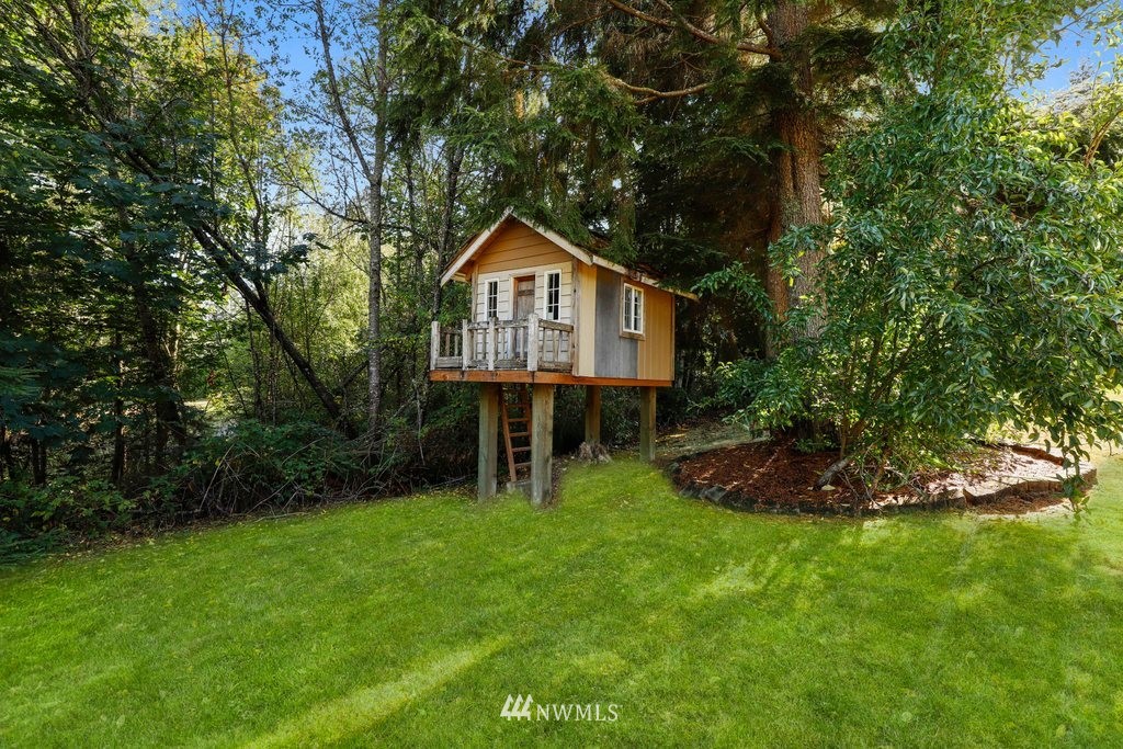 10606 Wagner Road Snohomish, WA 98290 - Photo 34 of 40 a front view of a house with a yard and trees