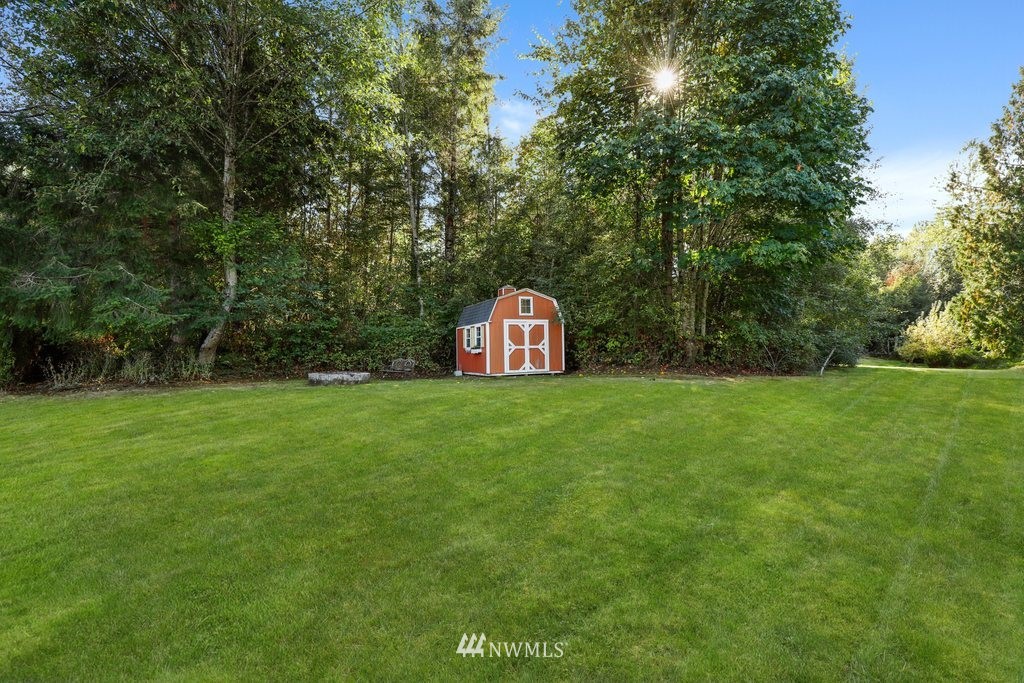 10606 Wagner Road Snohomish, WA 98290 - Photo 38 of 40 a view of a tiny house with a yard