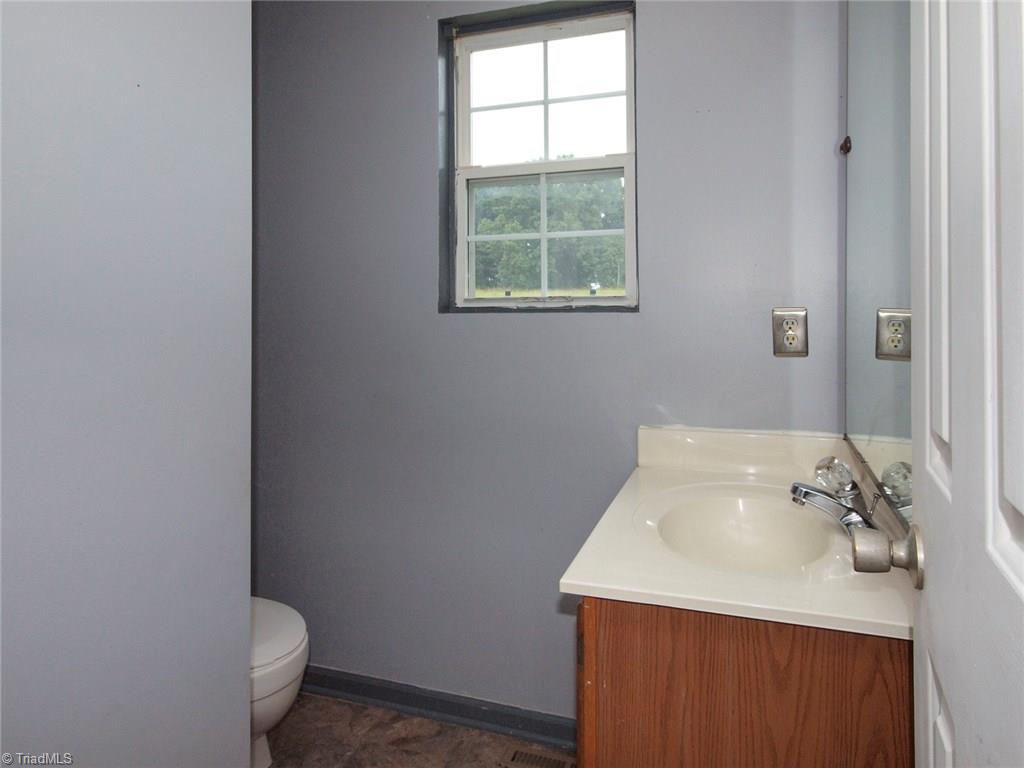 5855 Phillips Bridge Road Lewisville, NC 27023 - Photo 12 of 27 5855 Phillips Bridge Lewisville, North Carolina 27023: Downstairs half bath! Great for guests!