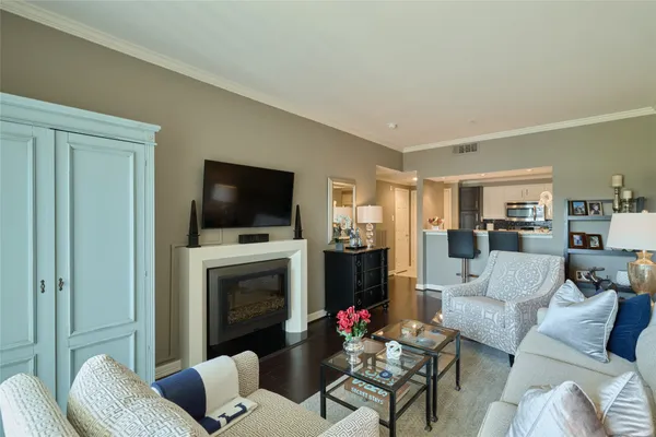 a living room with furniture flat screen tv and a fireplace