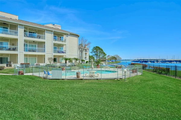 a house with swimming pool in front of it