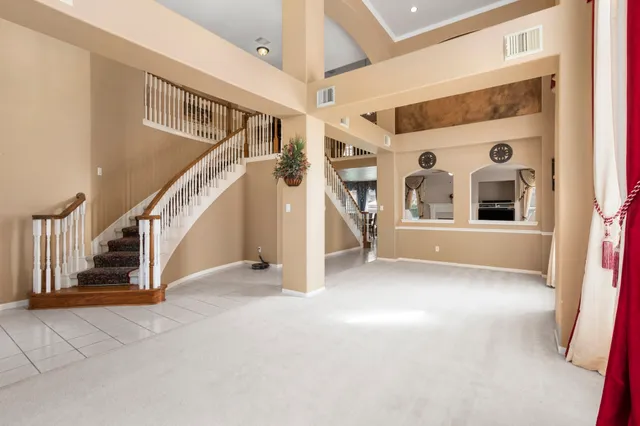 a view of a dining room with furniture and window