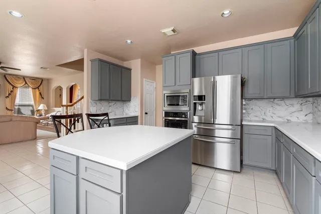 a bedroom with furniture and a tub