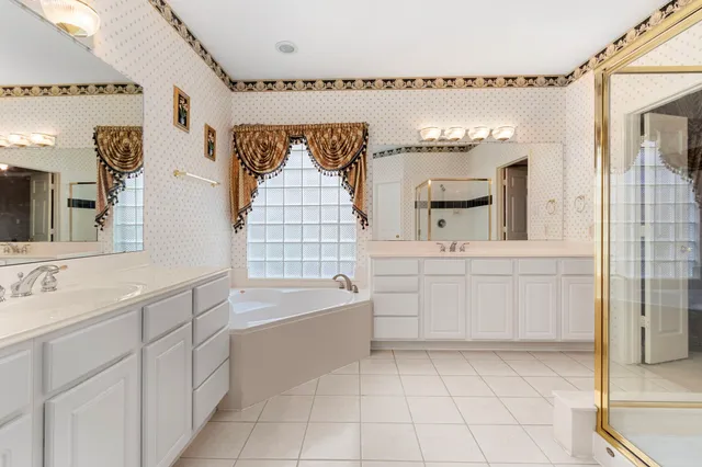 a utility room with cabinets dryer and washer