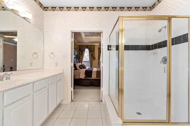 a living room with furniture a ceiling fan and a window