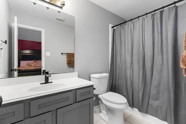 a room with a bed and a window