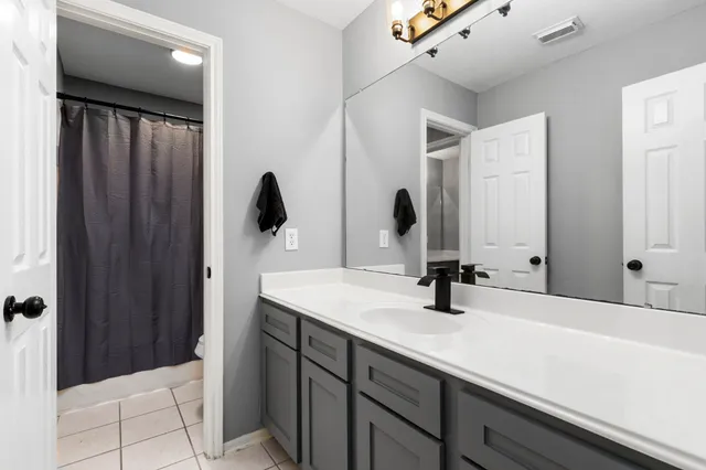 a view of a garden with a building in the background