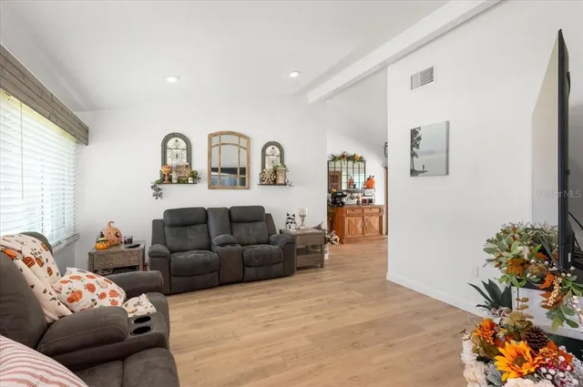a kitchen with stainless steel appliances granite countertop a sink and a refrigerator