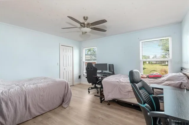 an aerial view of a house with swimming pool garden and patio