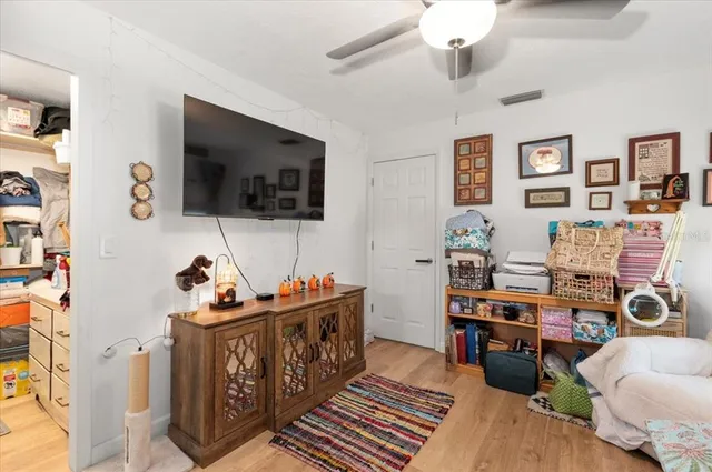 an aerial view of residential house with outdoor space and trees all around