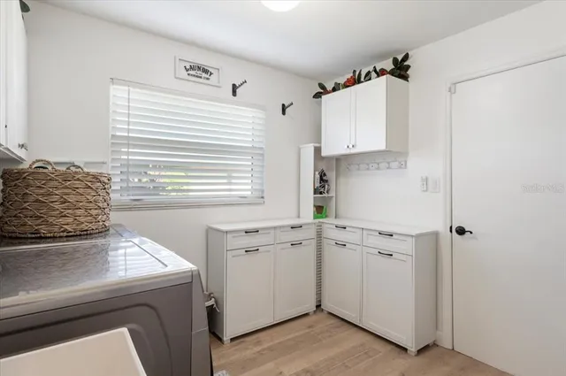 an aerial view of a house with a garden and swimming pool