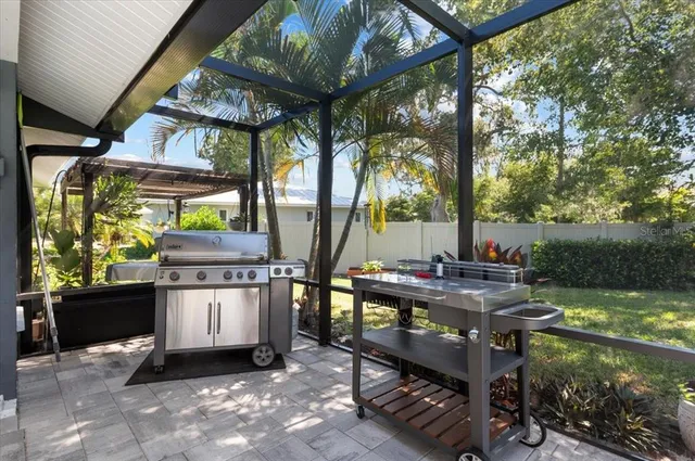 a view of a chairs and table in a patio