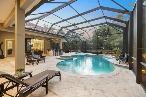 a view of a swimming pool with a patio