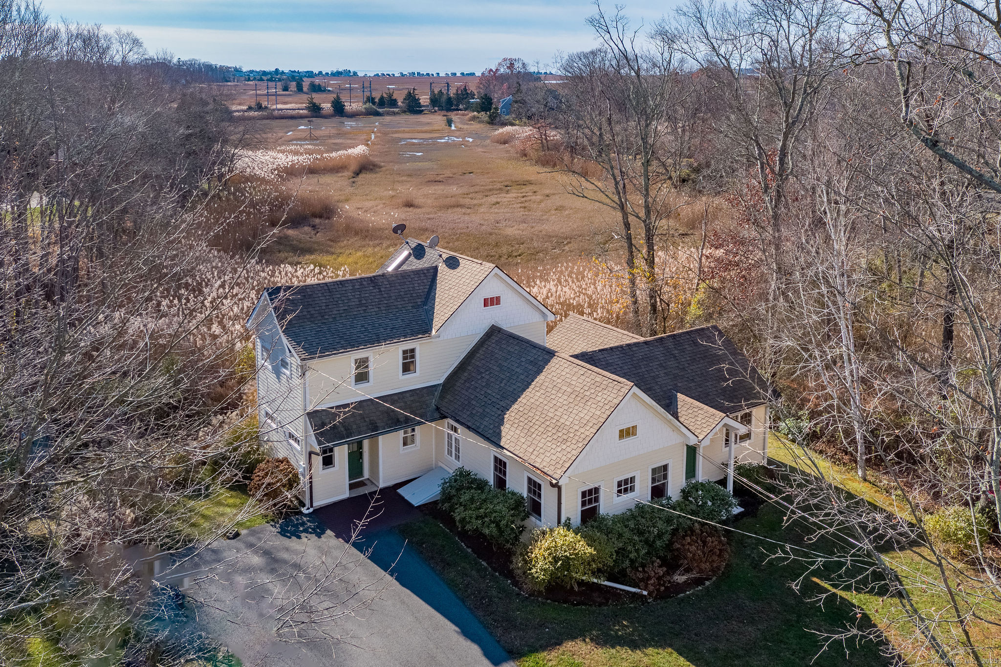 an aerial view of a house with a yard