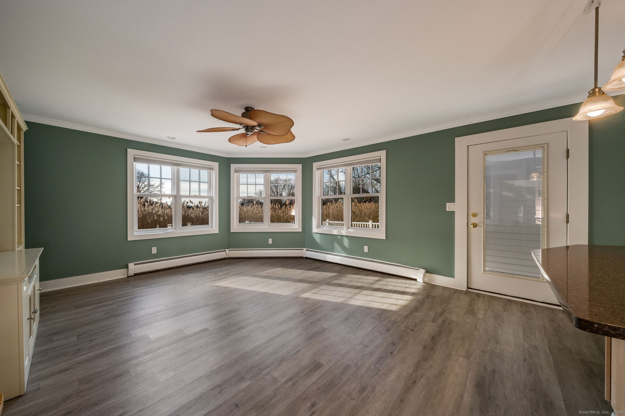 90 Boston Post Road Madison, CT 06443 - Photo 12 of 38 an empty room with wooden floor and windows