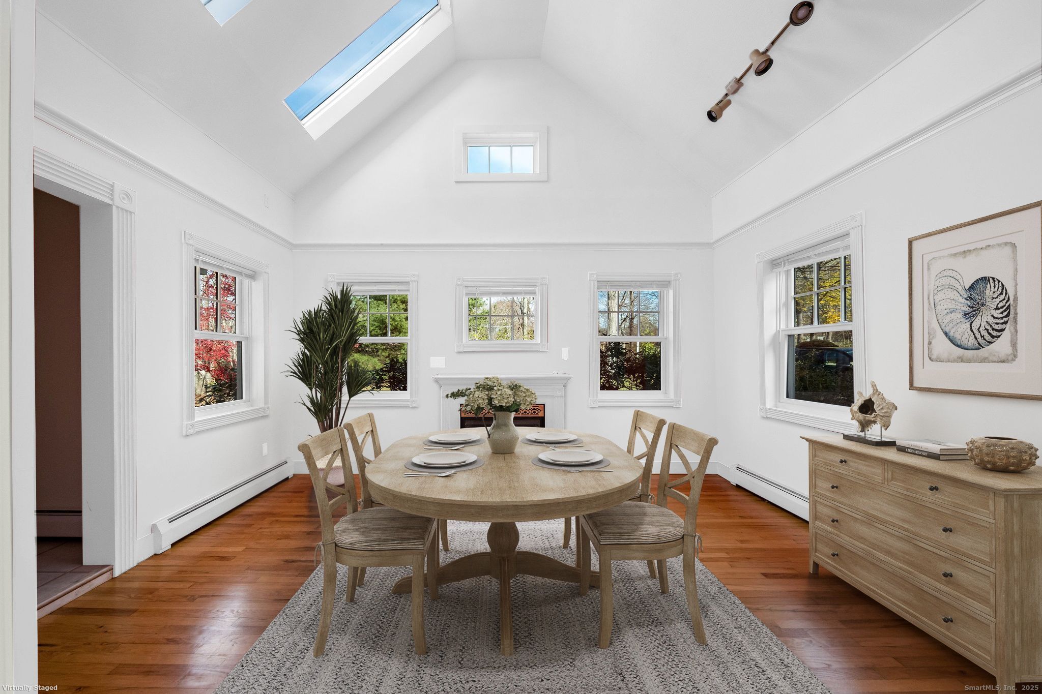90 Boston Post Road Madison, CT 06443 - Photo 15 of 38 a dining room with furniture window and wooden floor