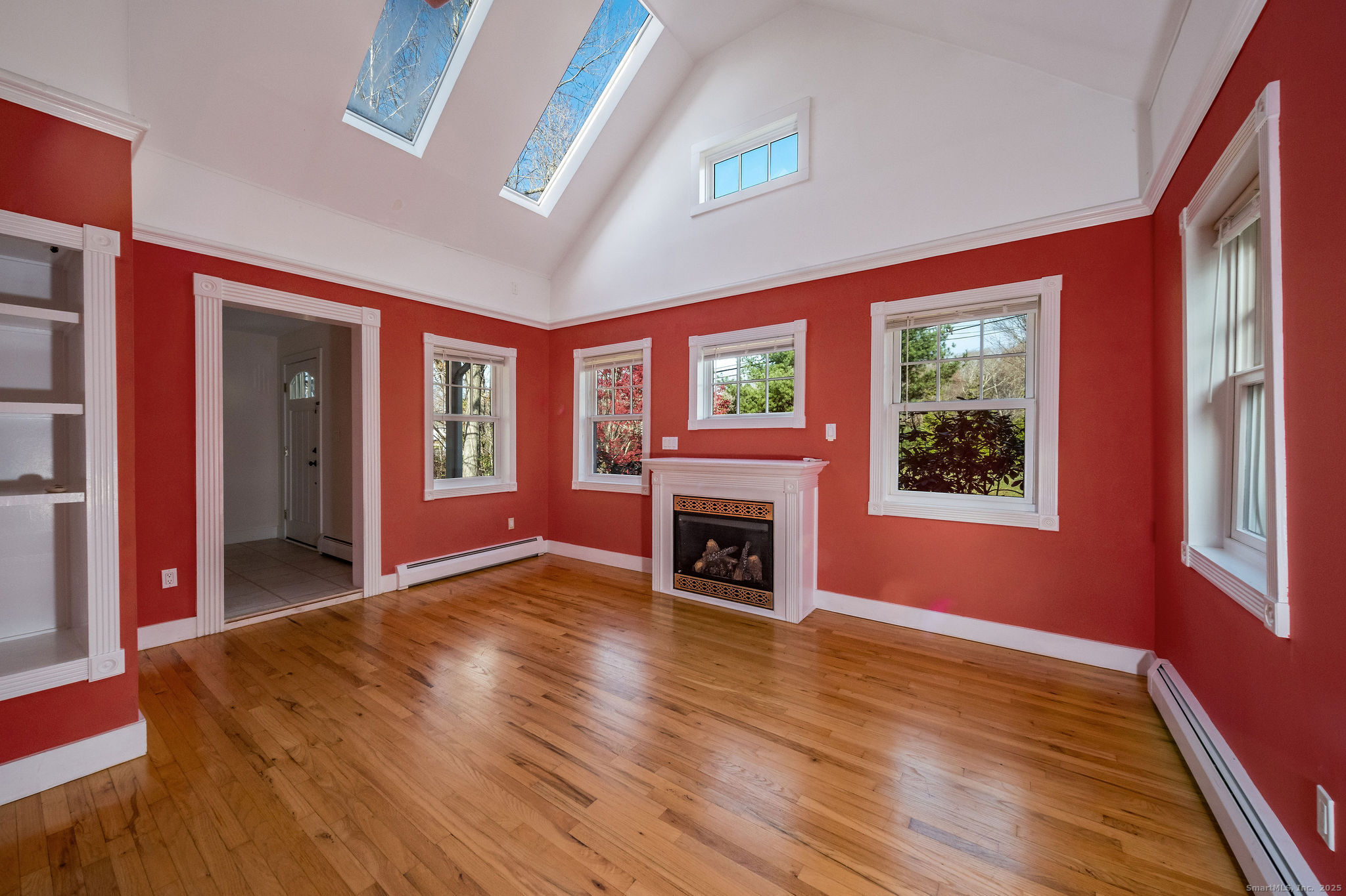 90 Boston Post Road Madison, CT 06443 - Photo 16 of 38 a view of livingroom with furniture window and fireplace