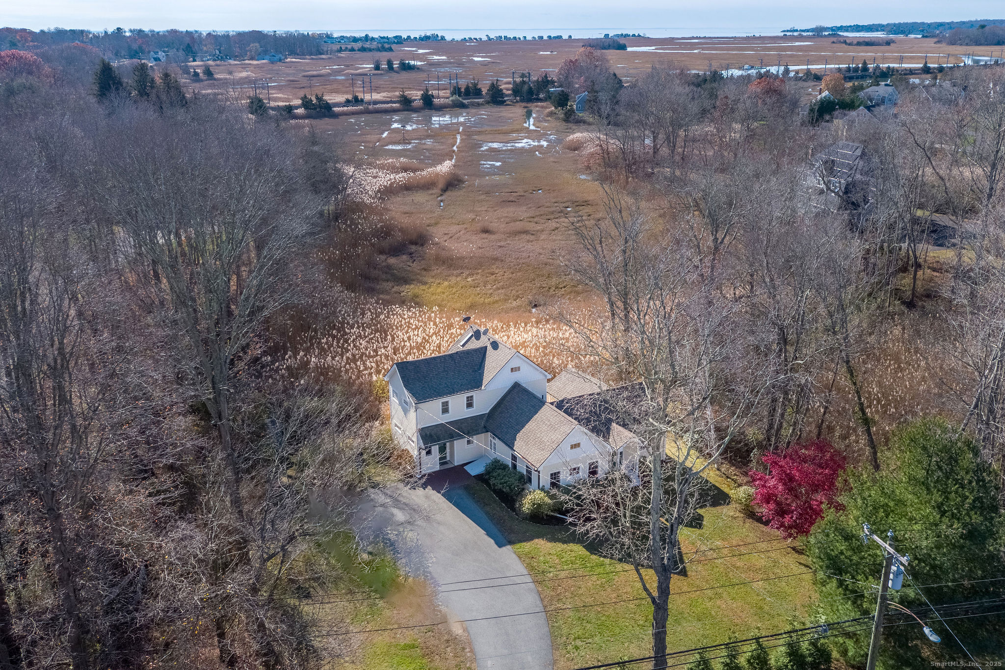 90 Boston Post Road Madison, CT 06443 - Photo 2 of 38 a view of a lake with a mountain in the background